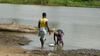 women_wash_dishes_in_the_river_near_Cotonou_Benin.JPG
