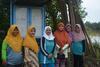 7 - Members of the Kampai women’s group in front of the community notice board where they record their test results