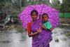 Mother and son in devastating heavy rain, Tamil Nadu, India